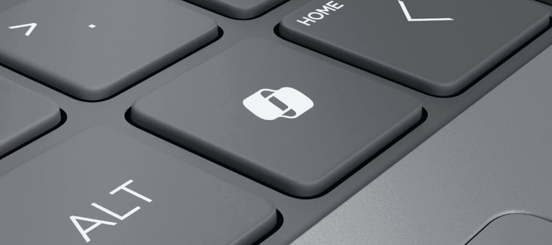 Una vista de cerca de un teclado de computadora, enfocándose en una tecla con un icono